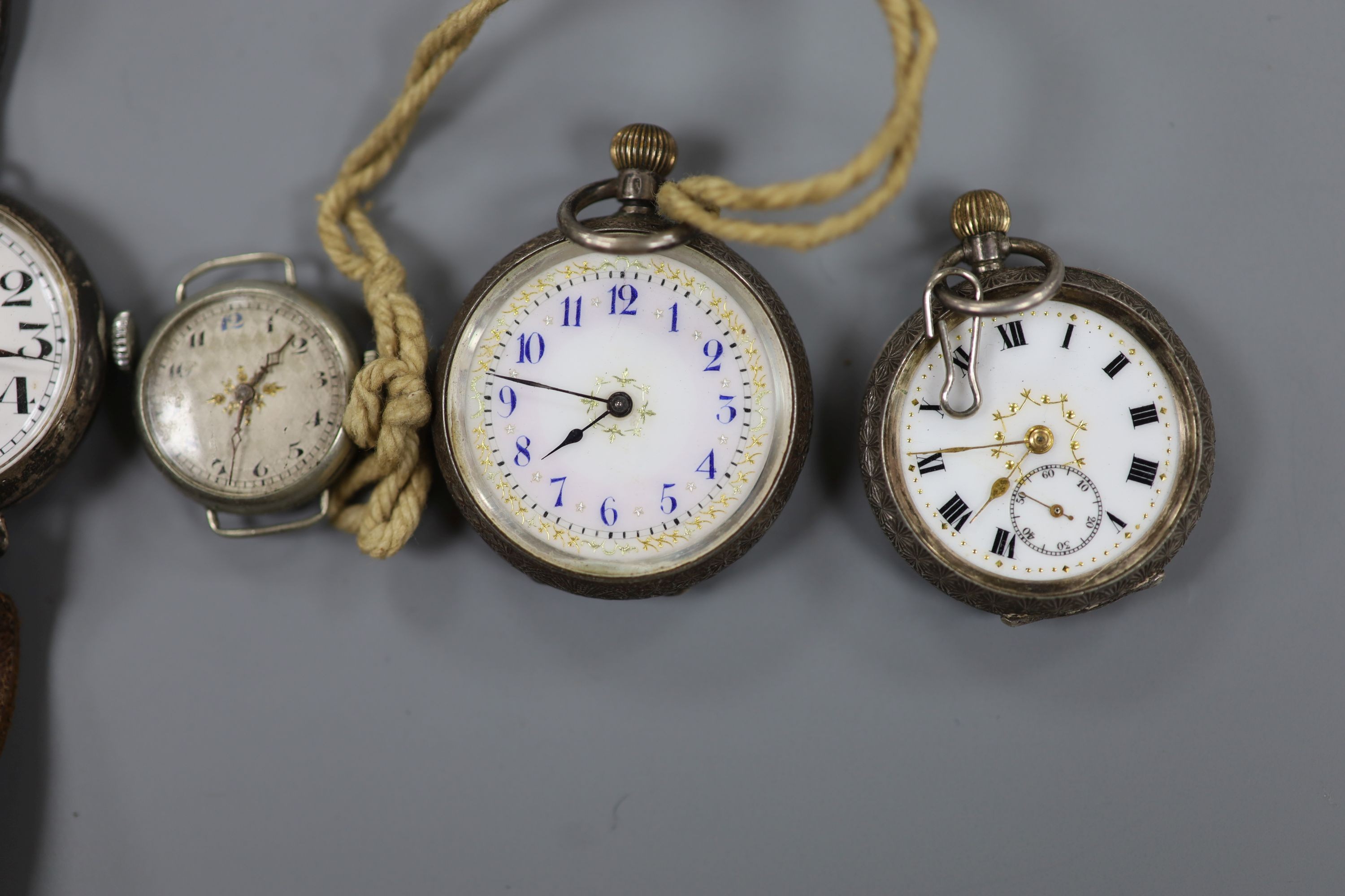 A gentleman's early 20th century silver trench wrist watch by J.W. Benson, four other wrist watches, two silver or white metal fob watches and a wrist watch case.